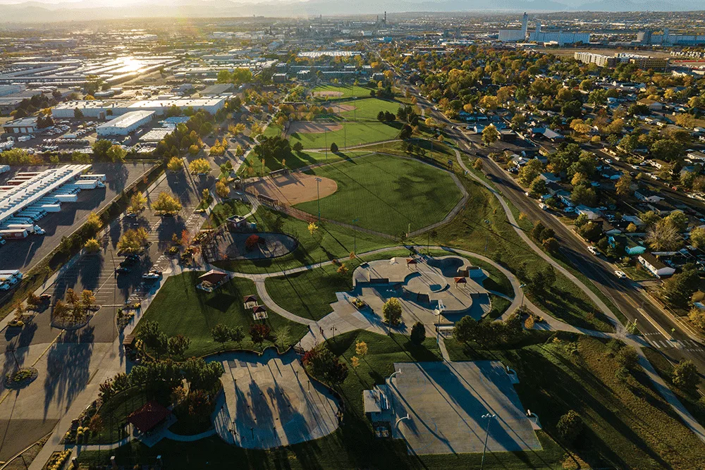 Aerial view of a park, sports fields and neighborhoods in Adams County, CO at sunset