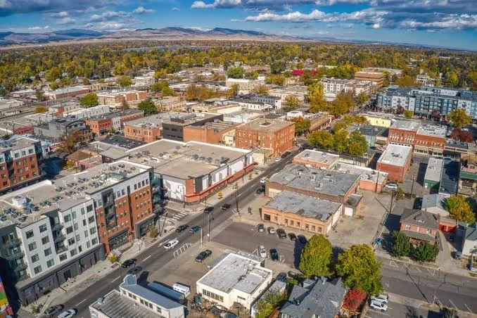 Aerial view of downtown Loveland, CO with mountains in the distance