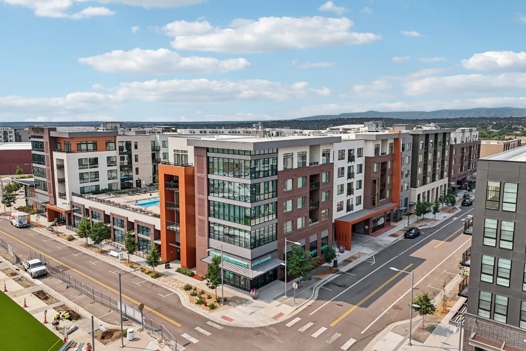 Modern apartment buildings at a street corner in Westminster, CO